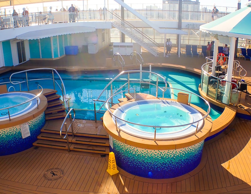 Hot tubs in the pool area on the NCL Pearl • Cruising on the Norwegian Pearl >> TastyItinerary.com