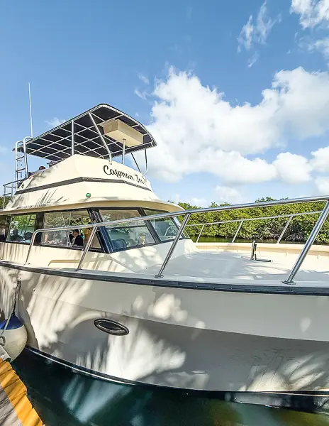 Tour boat docked at a marina in Grand Cayman before departing for a Stingray City and snorkeling excursion.