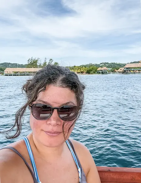 Kathy relaxing on the snorkeling boat in Roatán, Honduras, in the waters behind Brady’s Cay.