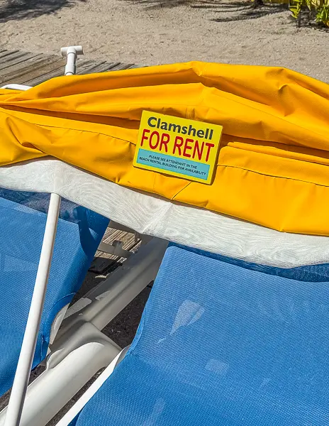 Close-up of a yellow clamshell lounger for rent at Harvest Caye, Belize, part of Norwegian Cruise Line’s private island.