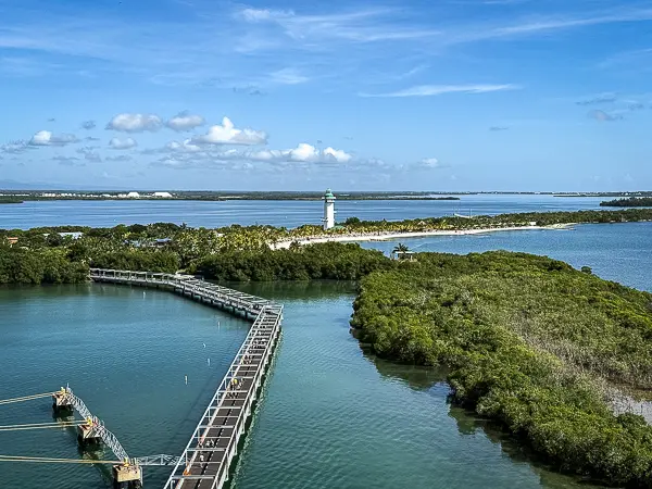 View of Harvest Caye, Belize from the cruise ship showing the long pier and lighthouse on Norwegian Cruise Line’s private island.