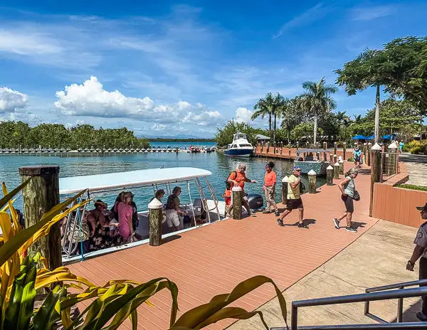 Cruise passengers at the Harvest Caye, Belize marina dock, where excursions and ferry rides to the mainland depart from Norwegian Cruise Line’s private island.