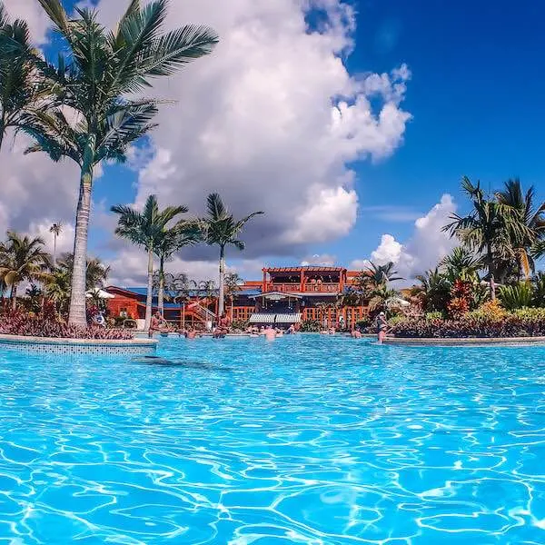 Inside the blue waters of the pool at Harvest Caye Belize