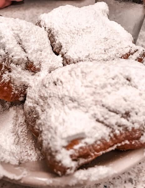 Beignets covered in powered sugar from Cafe du Monde in New Orleans