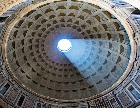Light shining through the dome of the Pantheon in Rome Italy