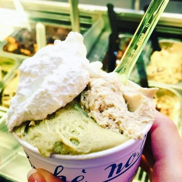 Pistachio gelato topped with whip cream