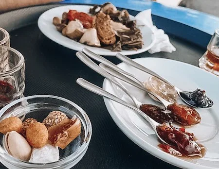 a tray with samplings of tasty local treats in Santorini Greece