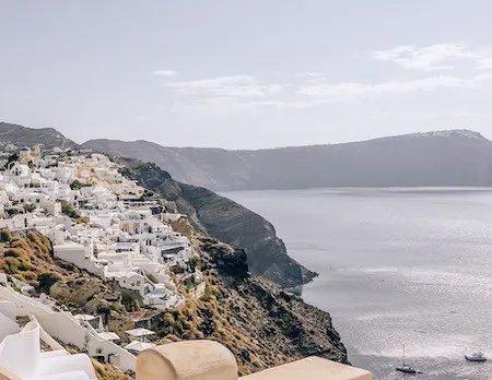 White mountainside homes looking over the caldera of Santorini, Greece