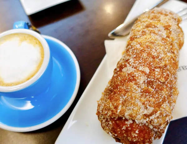 cafe con leche and a girona pastry 