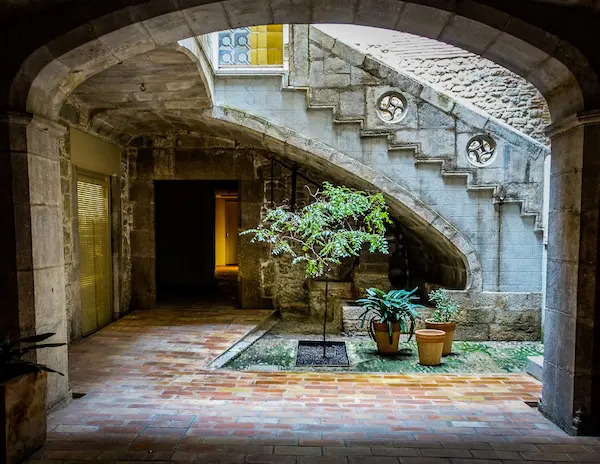 beautiful courtyards behind the entrances of resident buildings in girona