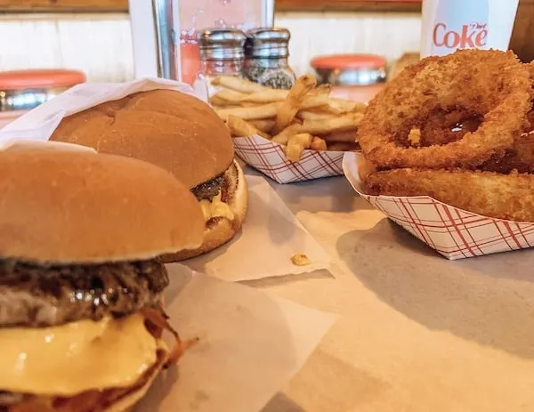 Bubba burgers with onions and fries in Kauai • TastyItinerary.com