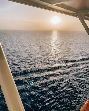 View of ocean and sunset from balcony of Celebrity Cruise
