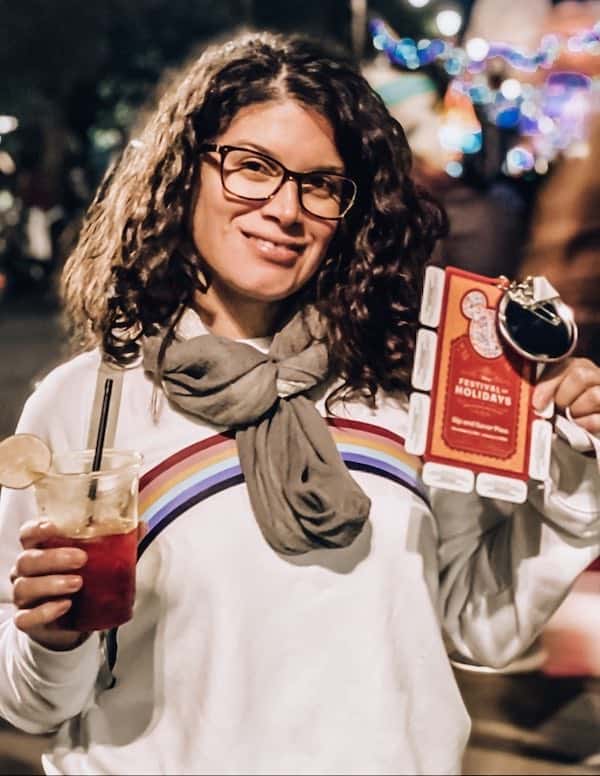 Holding my sip & savor pass and yummy drink at Festival of Holidays
