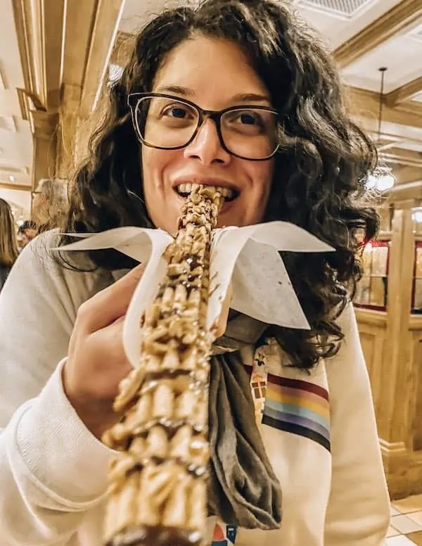 Enjoying a pecan pie churro at Festival of Holidays 