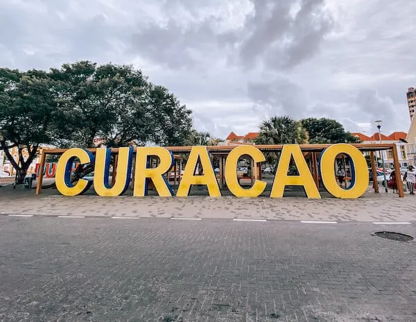 Larged sculpted sign that reads Curacao