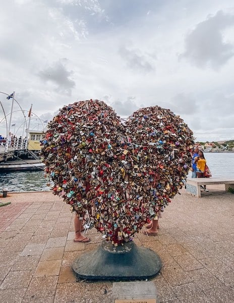 A heart shaped sculpture full of locks