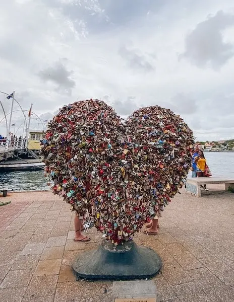 A heart shaped sculpture full of locks