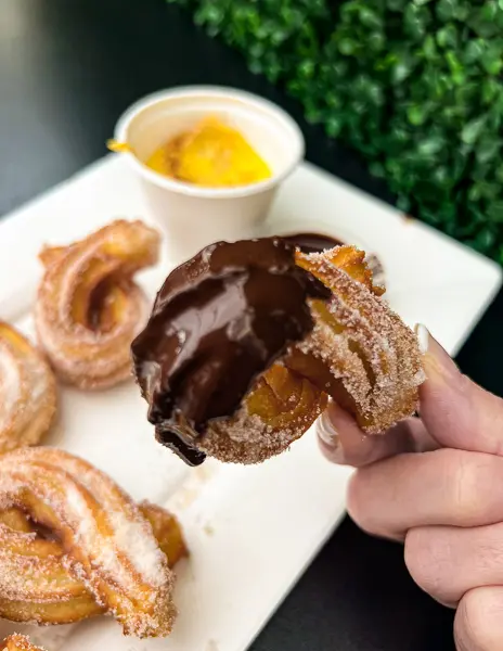 churro dipped in chocolate at amara cafe