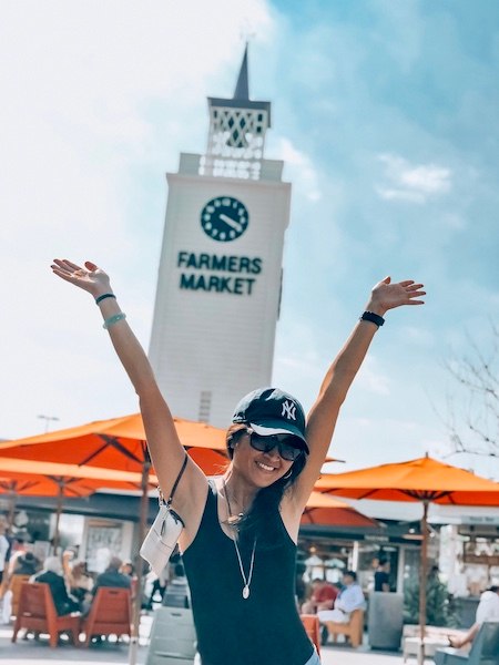 woman posing at the farmers market in los angeles