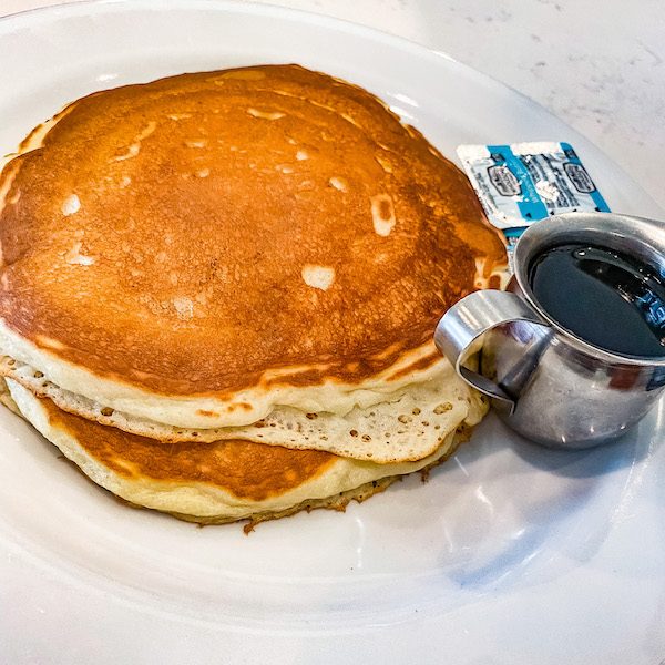 stack of pancakes and syrup