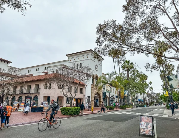 a bicyclist on state street in santa barabara