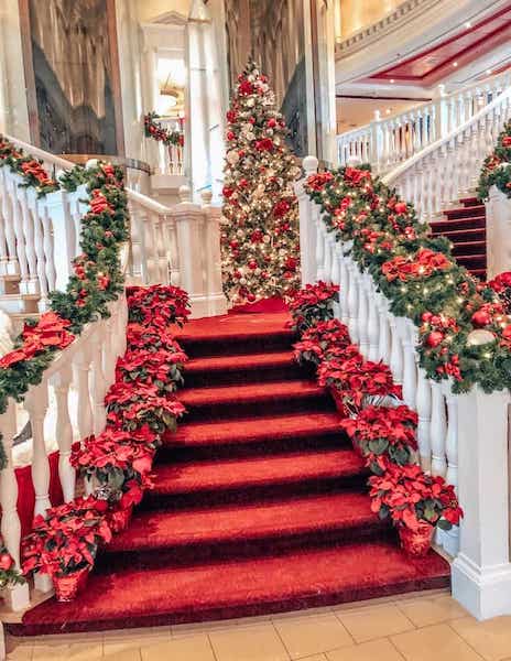 christmas tree and decor on cruise stairs and atrium