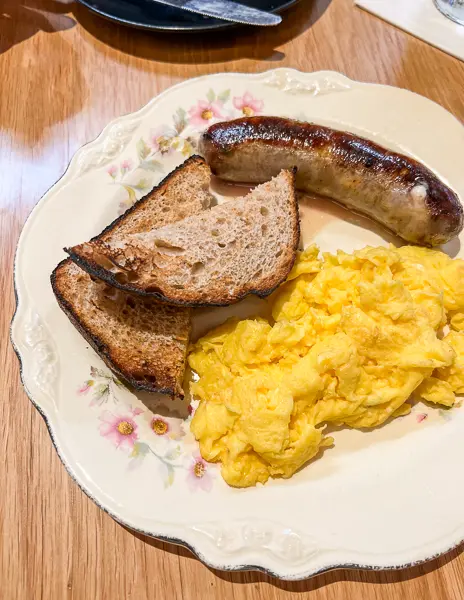cheddar stuffed bratwurst with eggs and toast