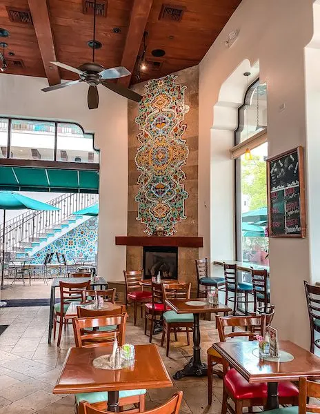 inside seating near a fireplace at urth cafe in pasadena