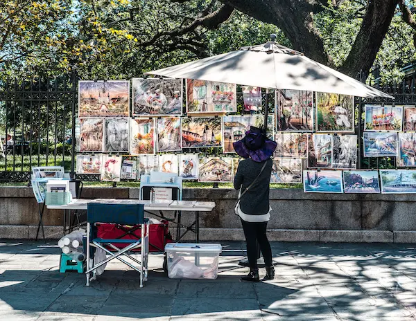 Local artist displaying paintings for sale at Jackson Square in the French Quarter, New Orleans.