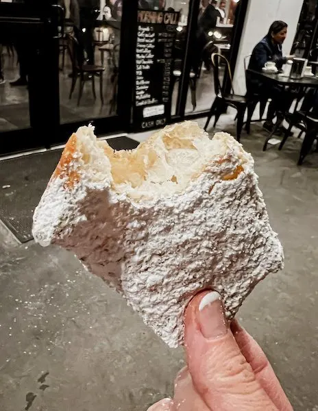 bit into beignet