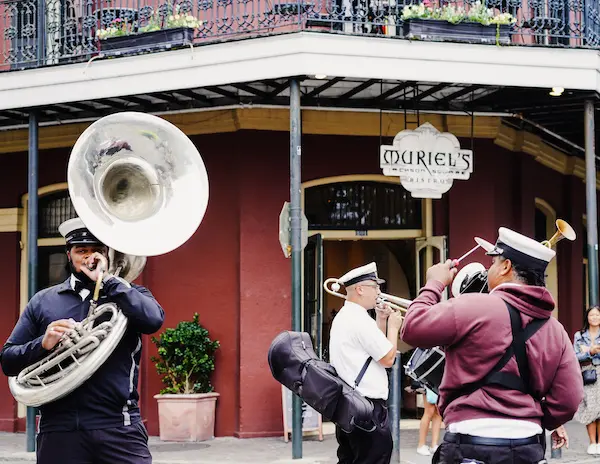 Second Line brass band playing outside Muriel’s Jackson Square in the French Quarter, New Orleans.