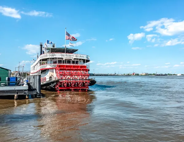Steamboat docked on the Mississippi River in New Orleans, ready for a river cruise.