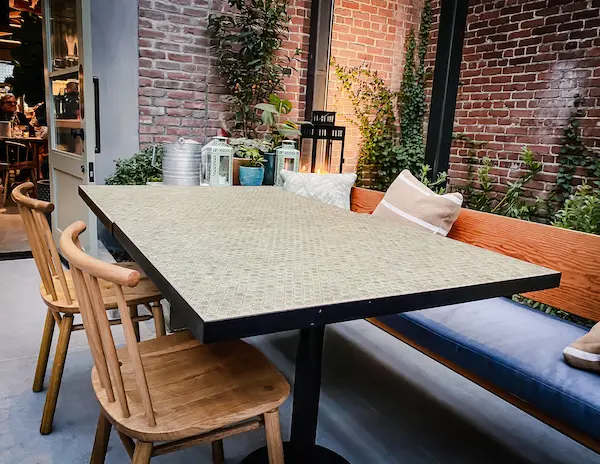 corner patio table with lit lanterns