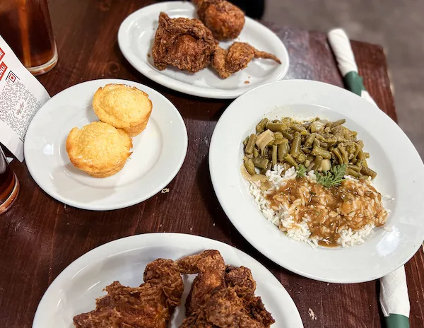 fried chicken, rice and string beans and cornbread spread