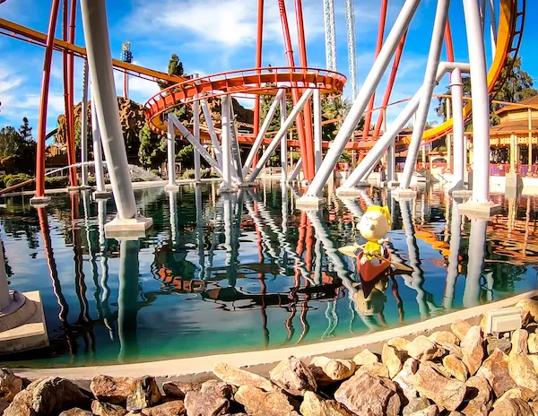 charlie brown kayaking under a rollercoaster