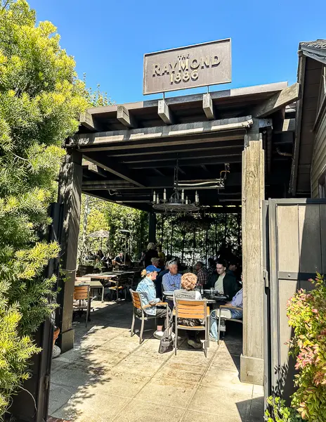 patio with cover and the raymond sign above