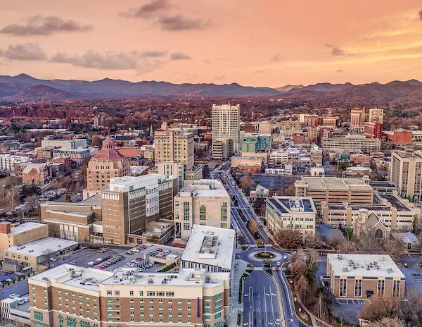 skyline of downtown asheville north carolina at sunrise