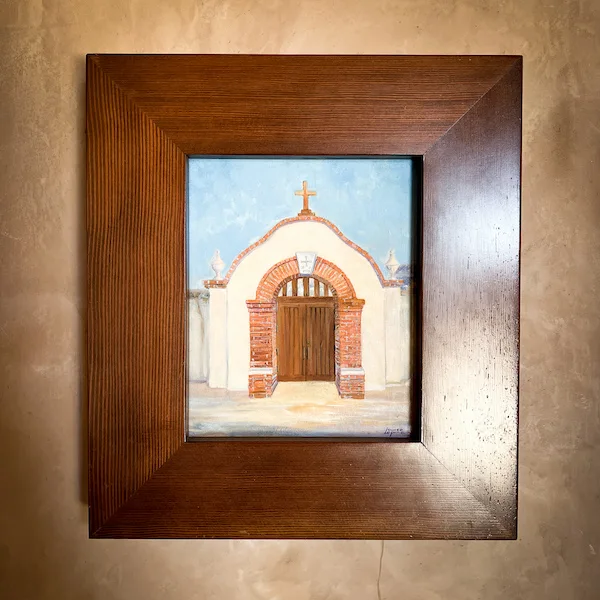 A framed painting of the entrance to Father Serra Chapel, on display inside Mission San Juan Capistrano.