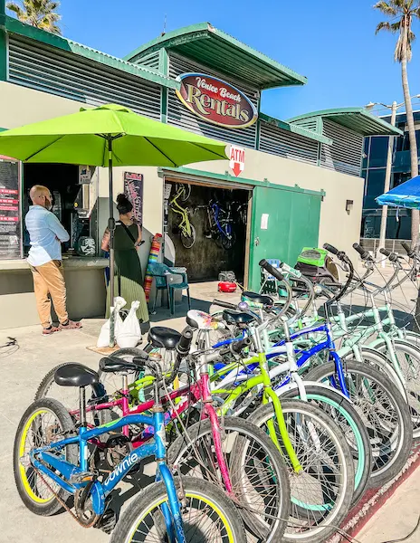 bikes lined up outside of rental shop