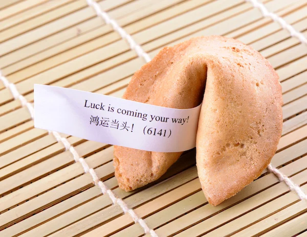 fortune cookie with the fortune that reads Luck is coming your way