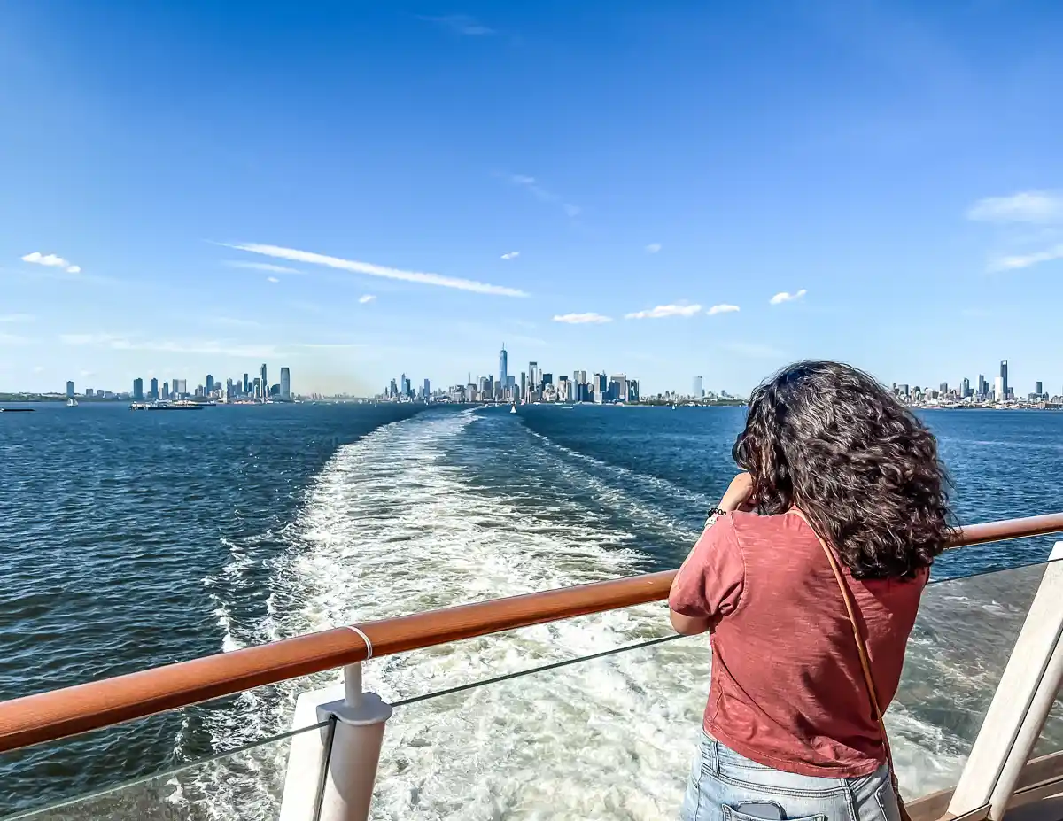 sailing away from new york city on the norwegian joy full skyline view