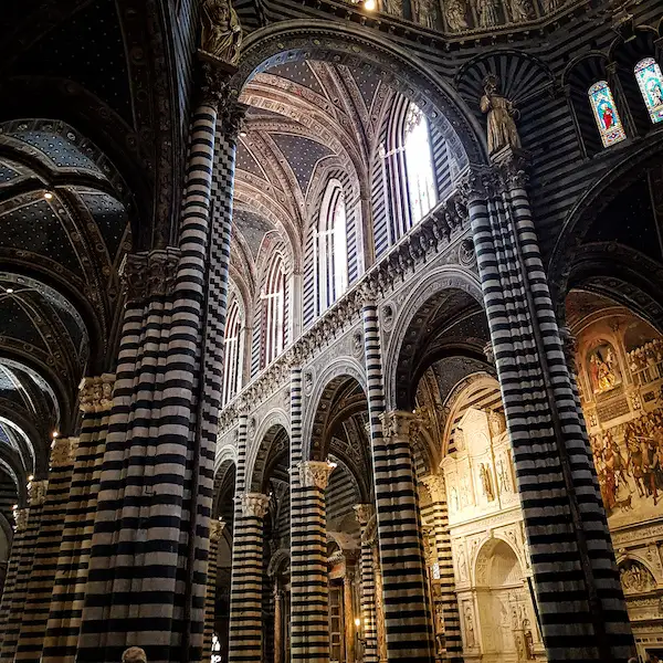 striped marble columns inside duomo di siena