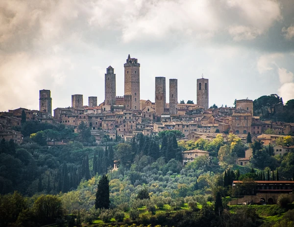 view of san gimignano from the rolling hills of tuscany