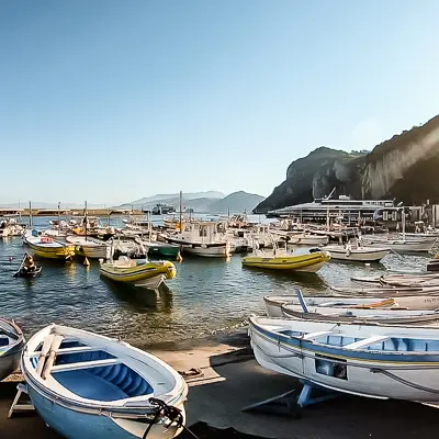 wooden and motor boats tide in the port of Capri