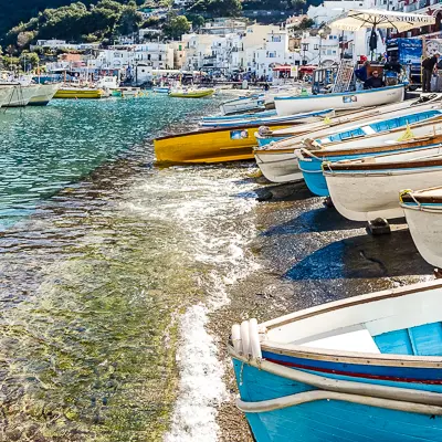 colorful wooden boats on the shores of marina grande in capri
