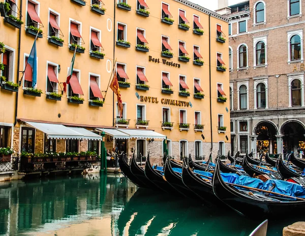 gondolas and canal by the best western in venice italy