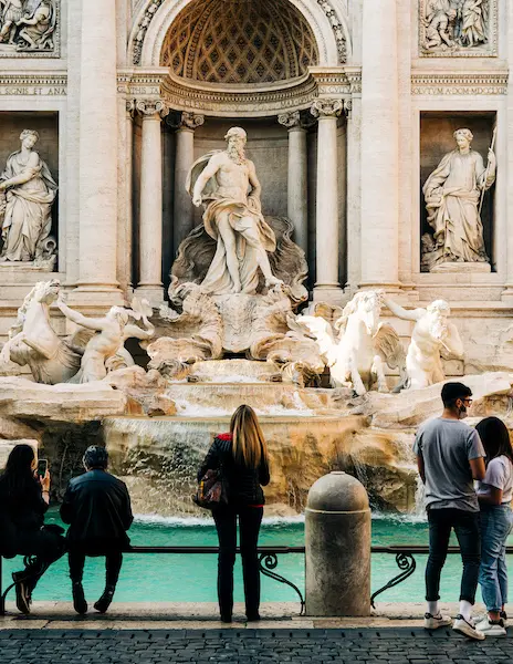 couples and locals enjoying trevi fountain in rome italy