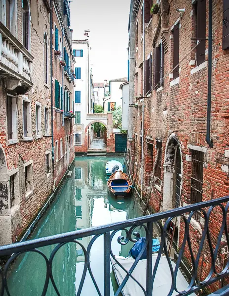 narrow charming canal in venice italy