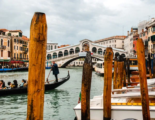 peek or rialto bridge in venice italy