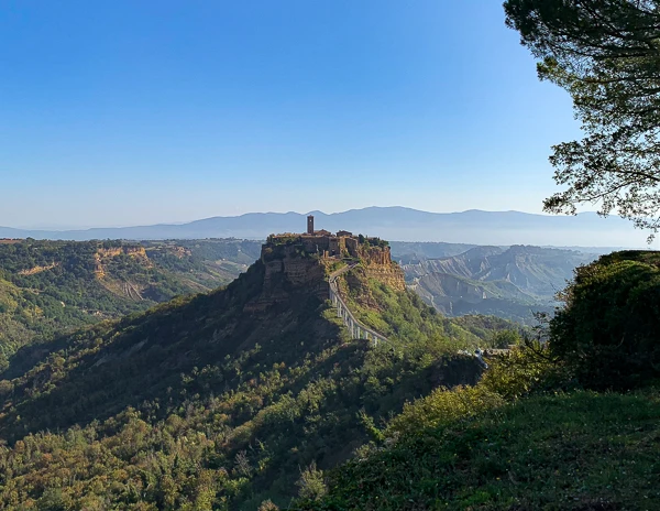 view of a europen town perched on a hilltop 